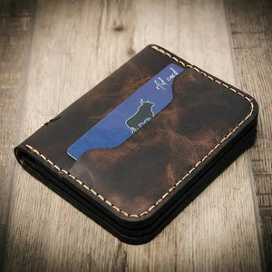 Brown leather minimalist badge wallet with a blue RFID card showing a bull silhouette.