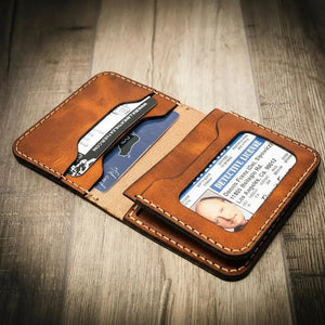 Brown leather bifold wallet with driver's license and card slots.