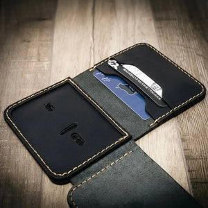 Black leather minimalist badge wallet with card slots and ID window.
