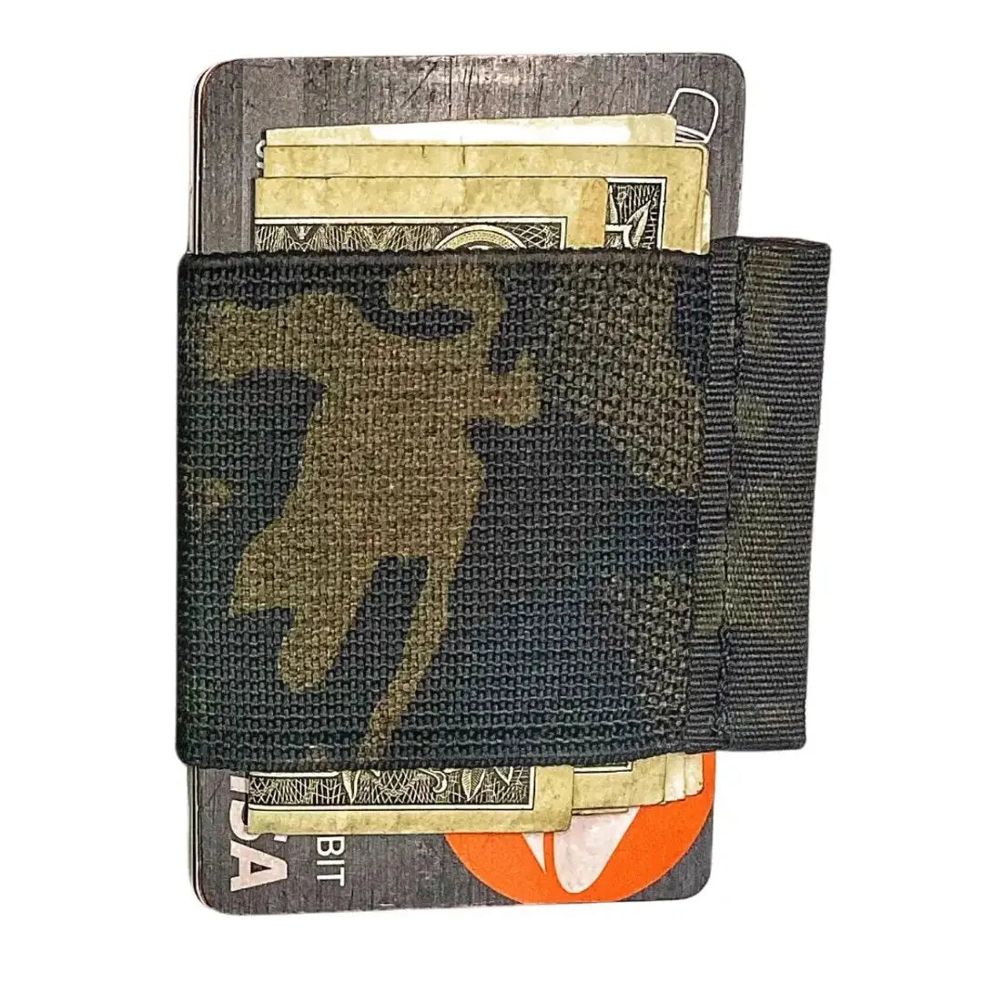 Minimalist elastic card wallet with camouflage band holding cash and cards.