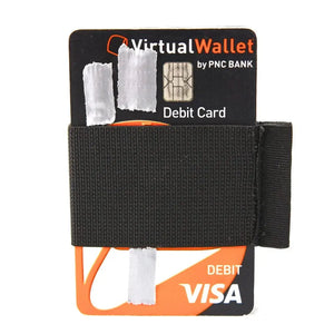 Minimalist black elastic card band wallet holding debit cards