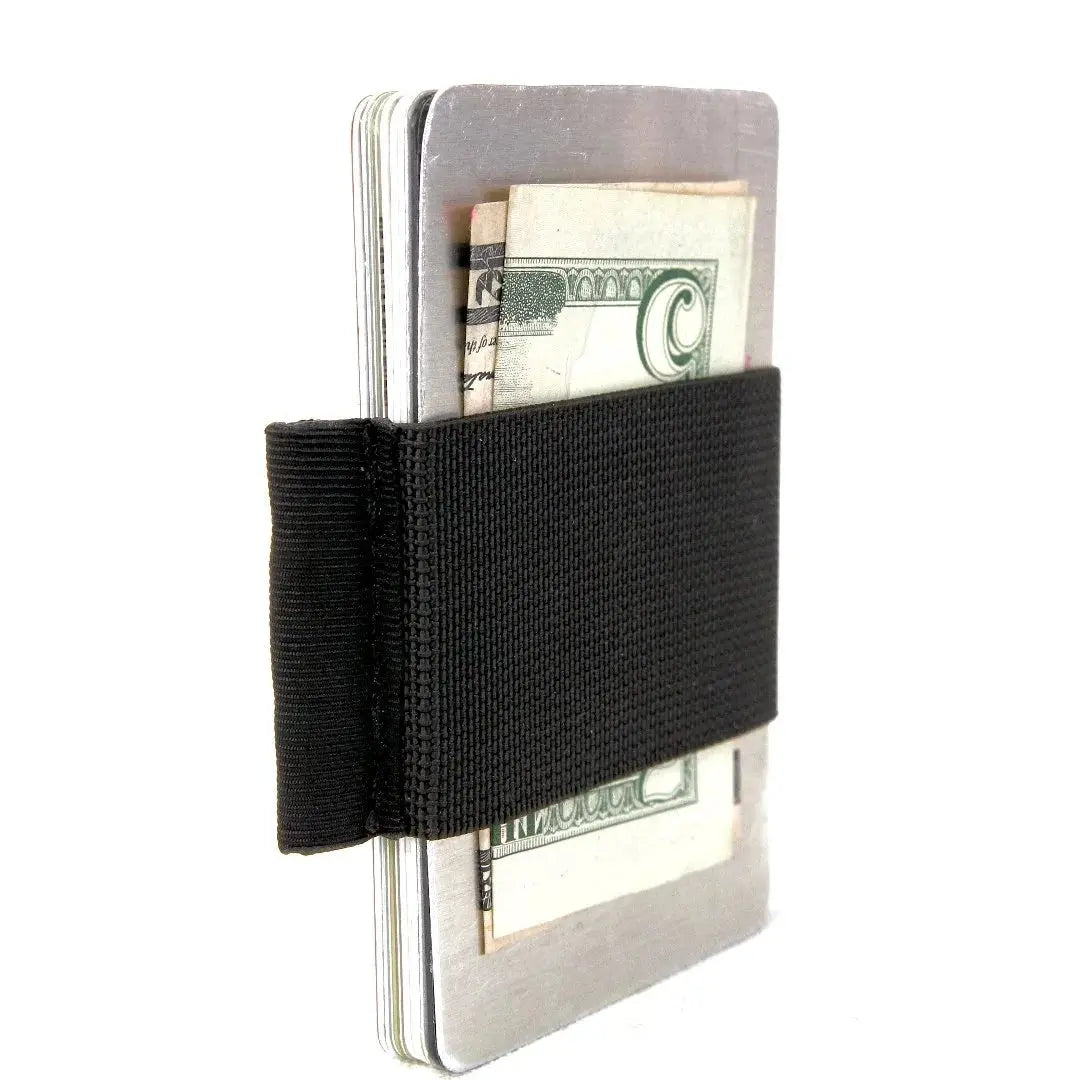 Metallic card holder with black elastic band holding cash