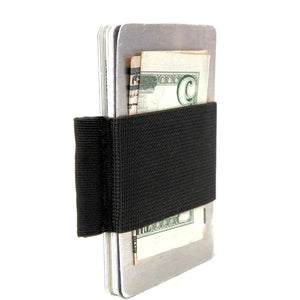 Metallic card holder with black elastic band holding cash