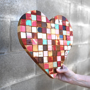 Mosaic heart art made of colorful reclaimed wood blocks