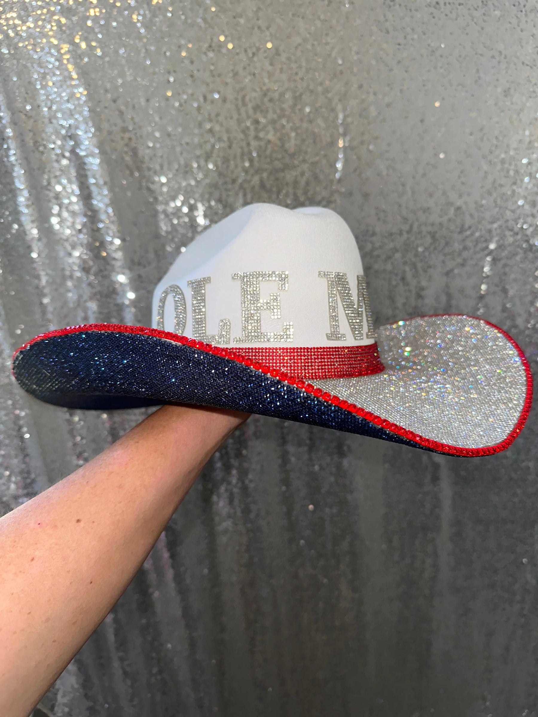 White Ole Miss cowboy hat with navy blue brim and rhinestones