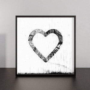 Ornamental heart artwork with black and white filigree pattern.
