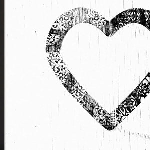 Black and white ornamental heart art print with filigree pattern detail.