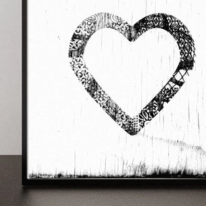Black and white ornate heart art print with distressed wood background.