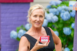 Woman holding a pink Prosecco soap slice with "A Slice of the Good Life" label