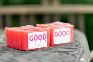 Two pink soap bars labeled "A Slice of the Good Life" with "Prosecco" visible.