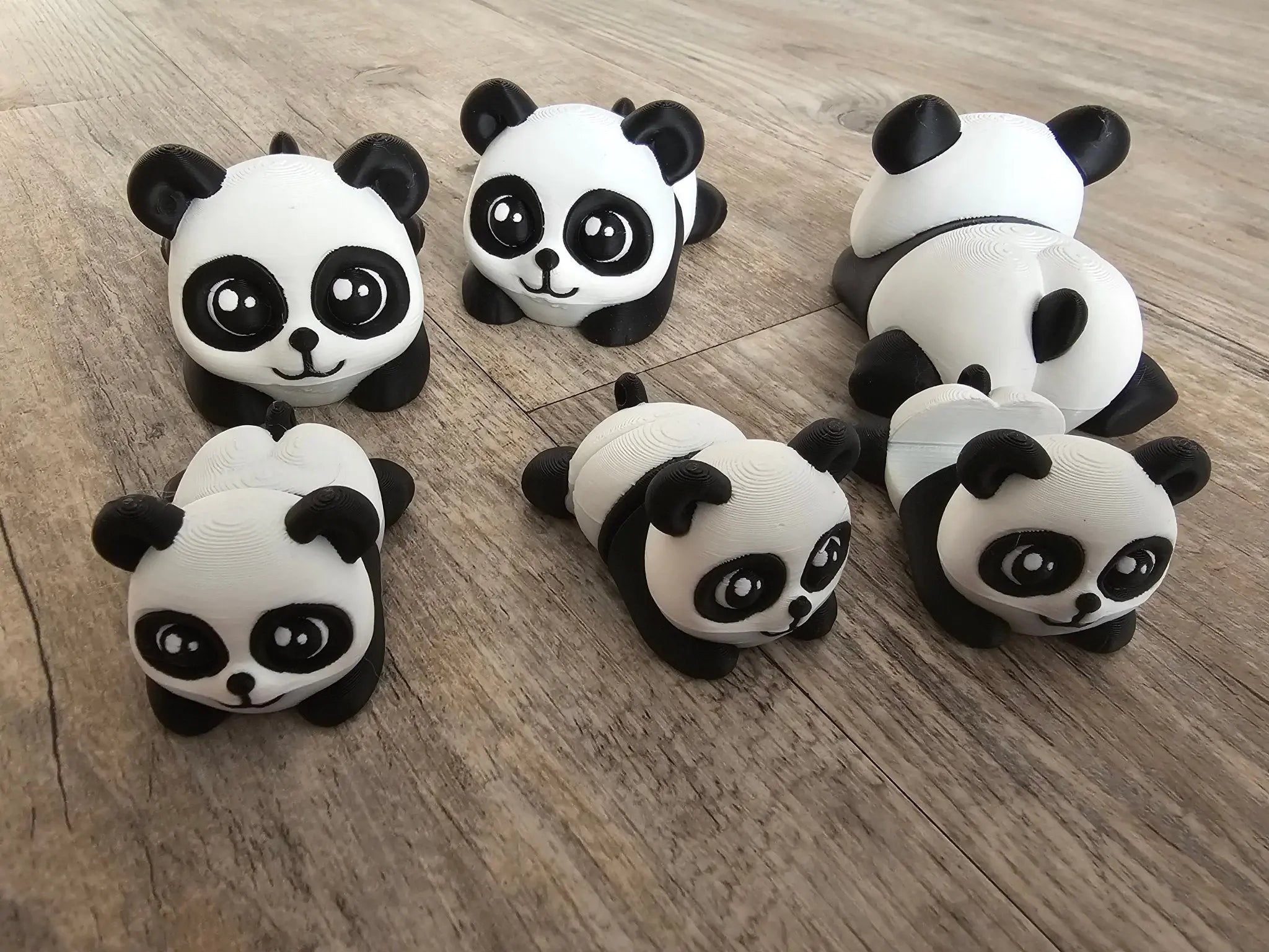Panda Family Fidget Set: 6 3D Printed Panda Toys, Phone Holder, and Wiggly Butts from Main Street Collective. Cute animal desk decor.