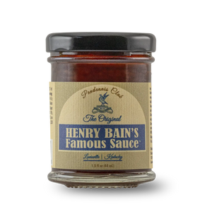 Glass jar of Henry Bain's Famous Sauce with a tan label and black lid.
