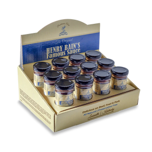 Display box of Henry Bain's Famous Sauce bottles with "Pendennis Club" branding.
