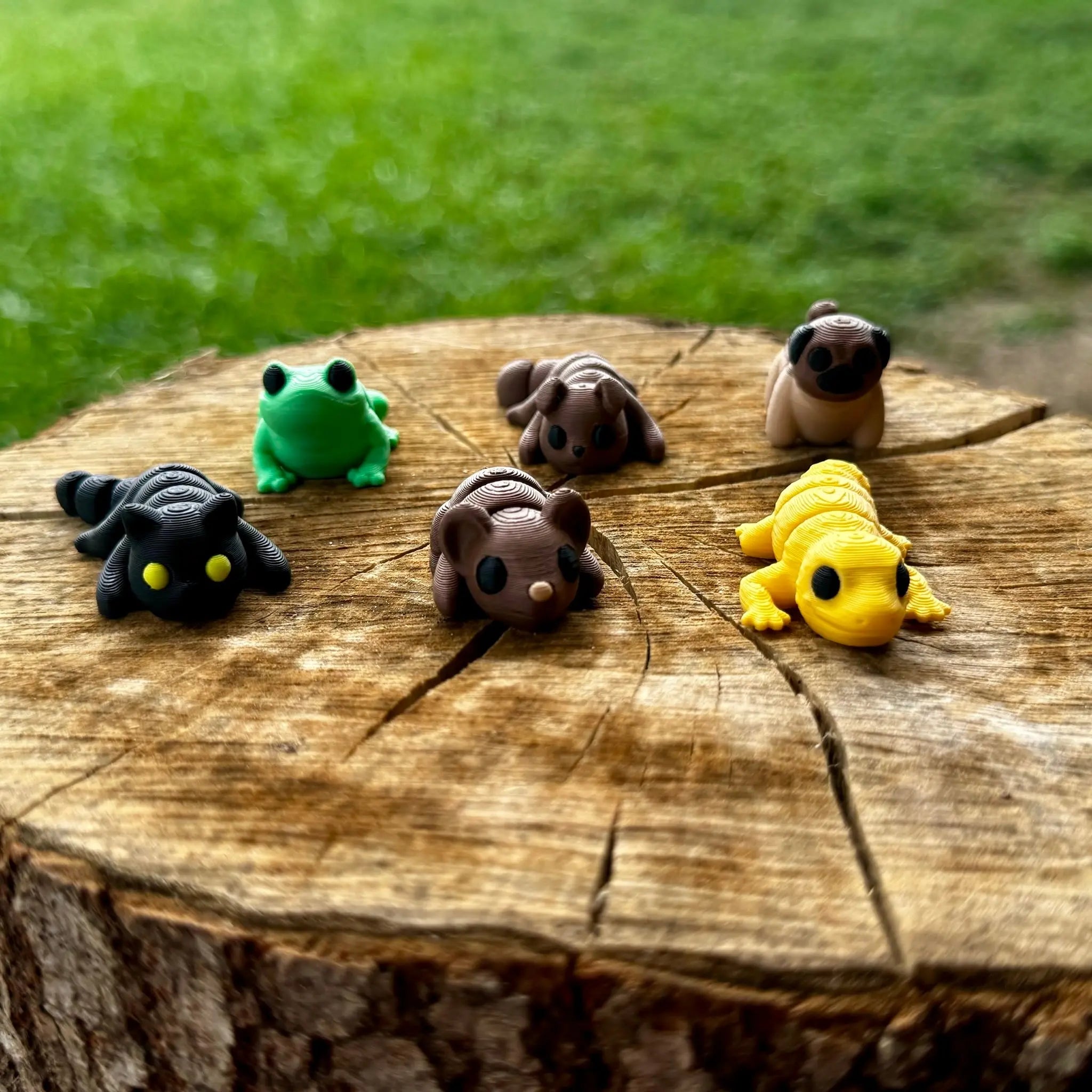 3D printed animal figurines wholesale bundle: cat, dog, frog, gecko, mouse, pug, farm animals on wood. Main Street Collective