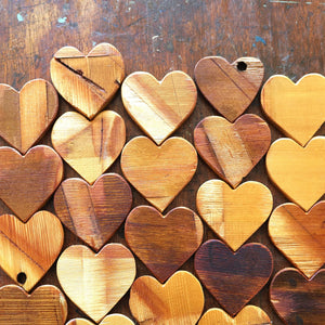 Arrangement of wooden hearts made from reclaimed piano soundboard wood.