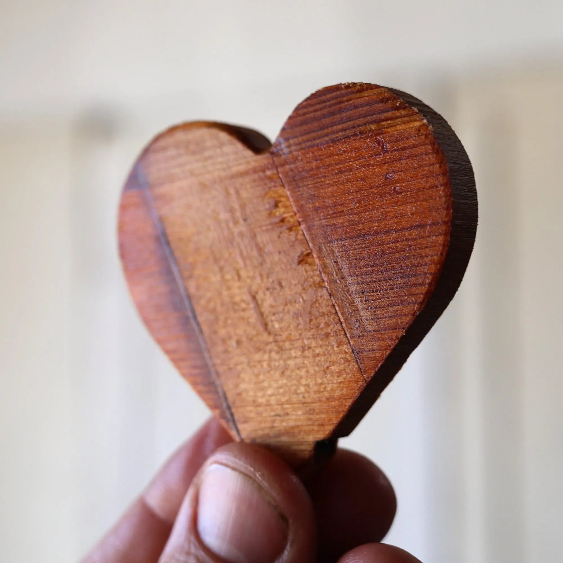 Wooden heart made from reclaimed piano soundboard wood.