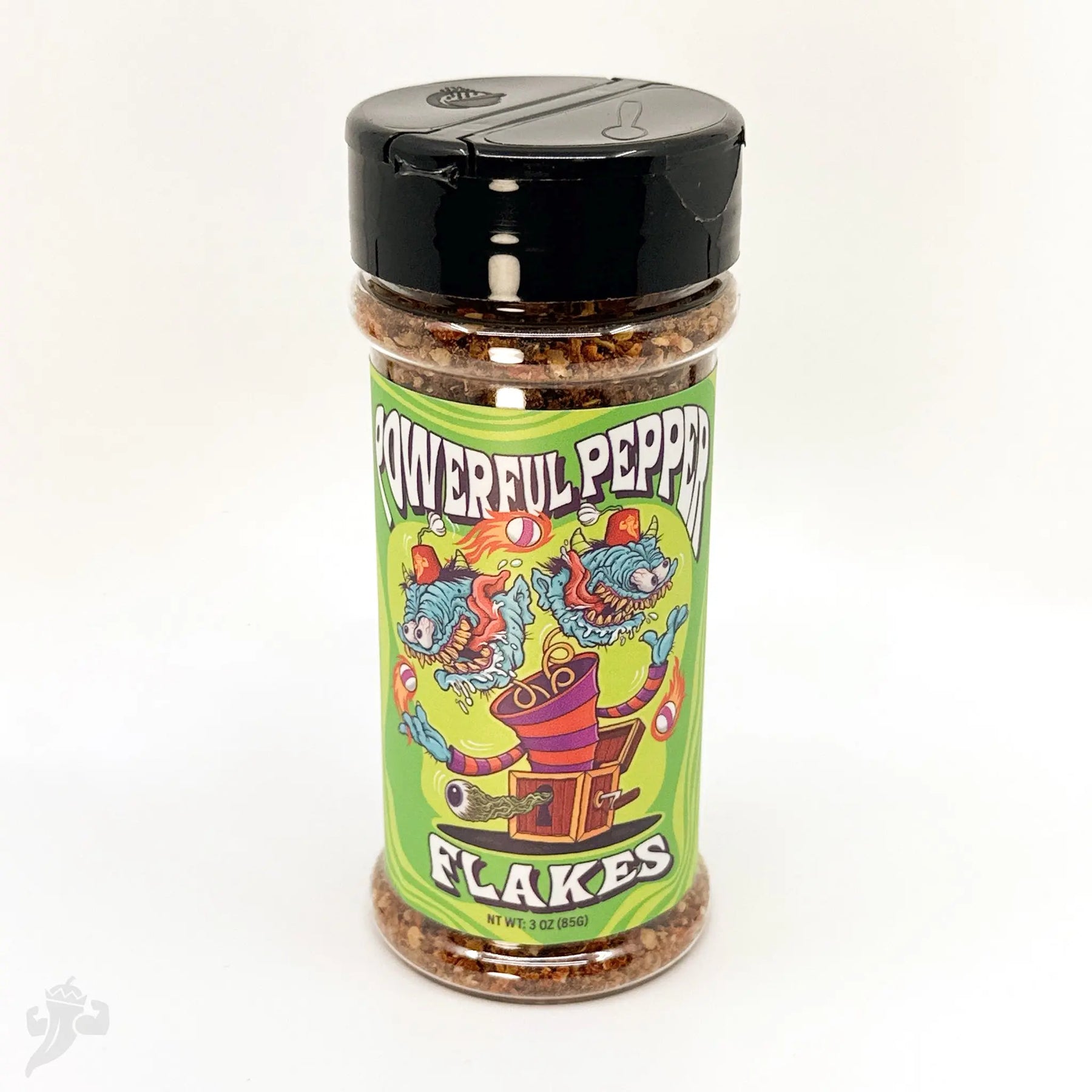 Clear plastic bottle of Powerful Pepper Flakes with a green label featuring cartoon monsters