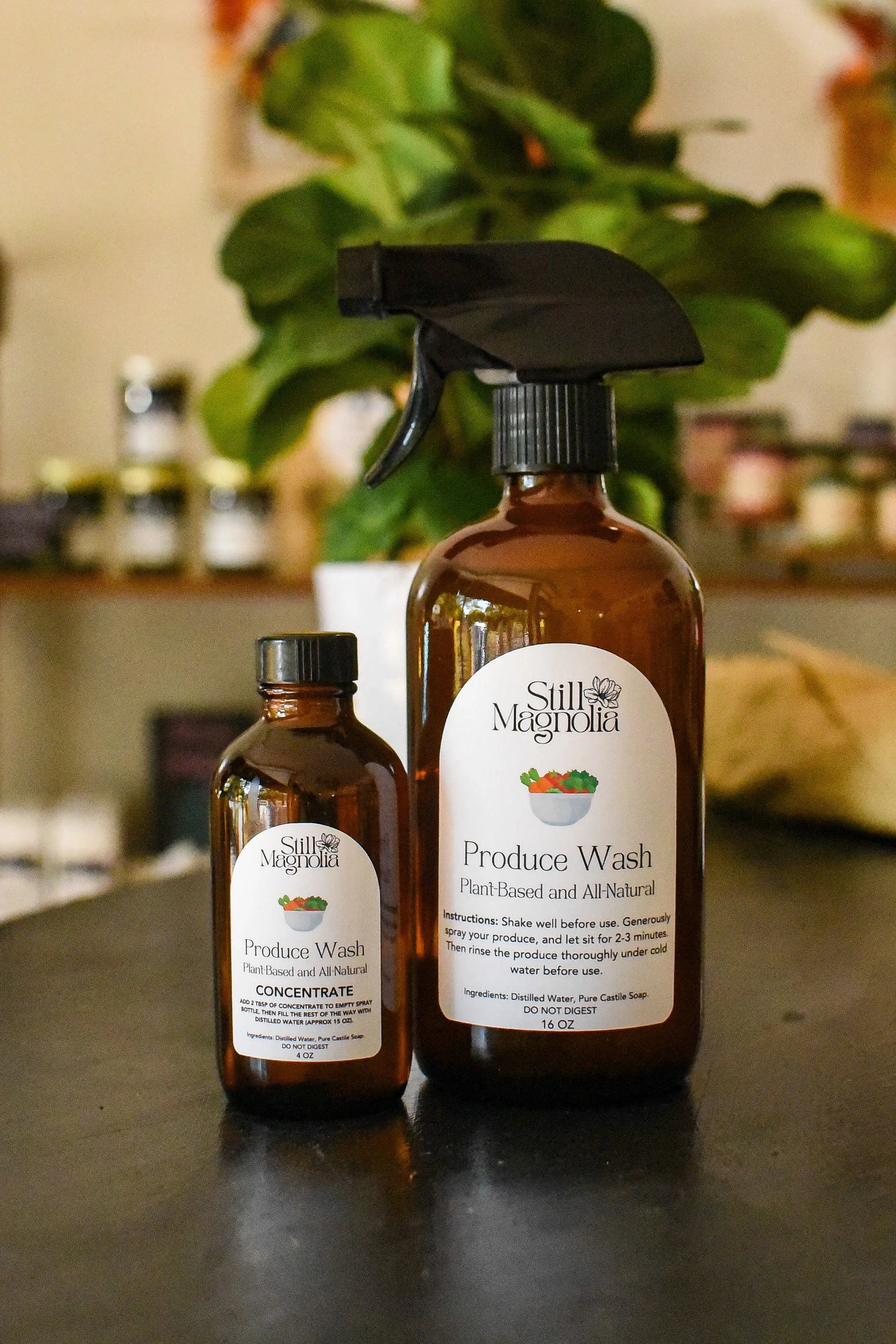 Still Magnolia plant-based produce wash concentrate and spray bottle.