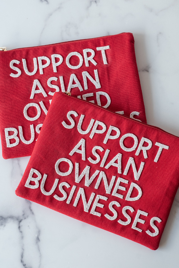 The Support Asian Owned Businesses Clutch by TheTinyTassel, handmade leather goods main product photo