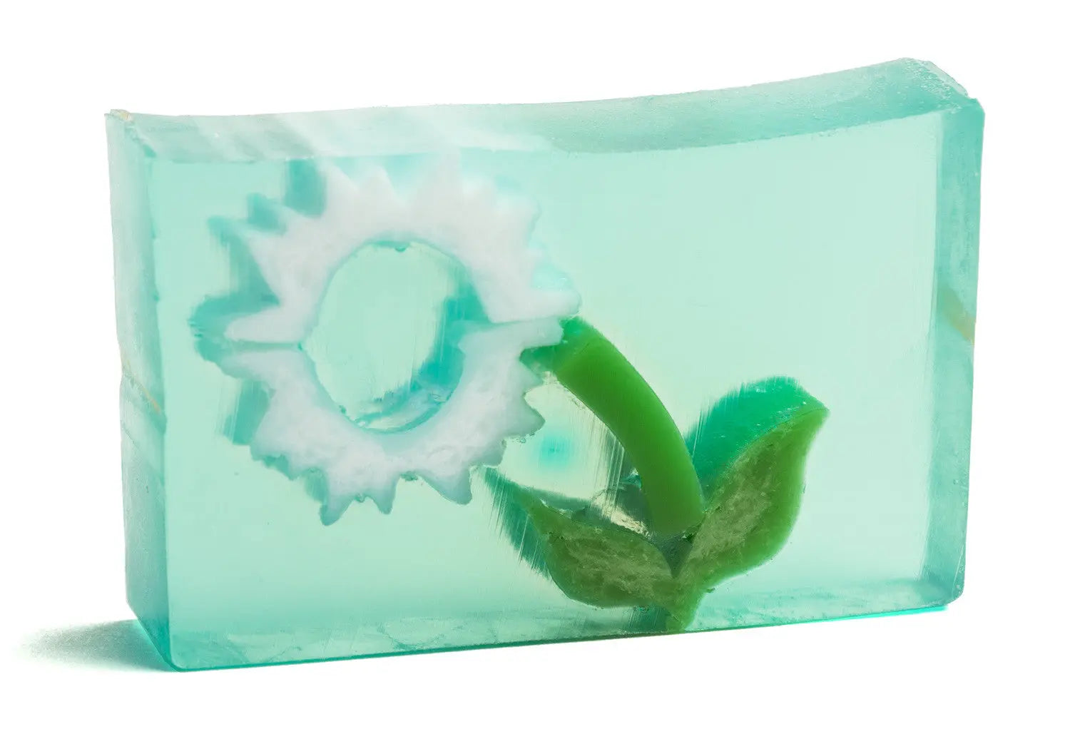 Clear soap bar with white dandelion puff flower and green stem inside