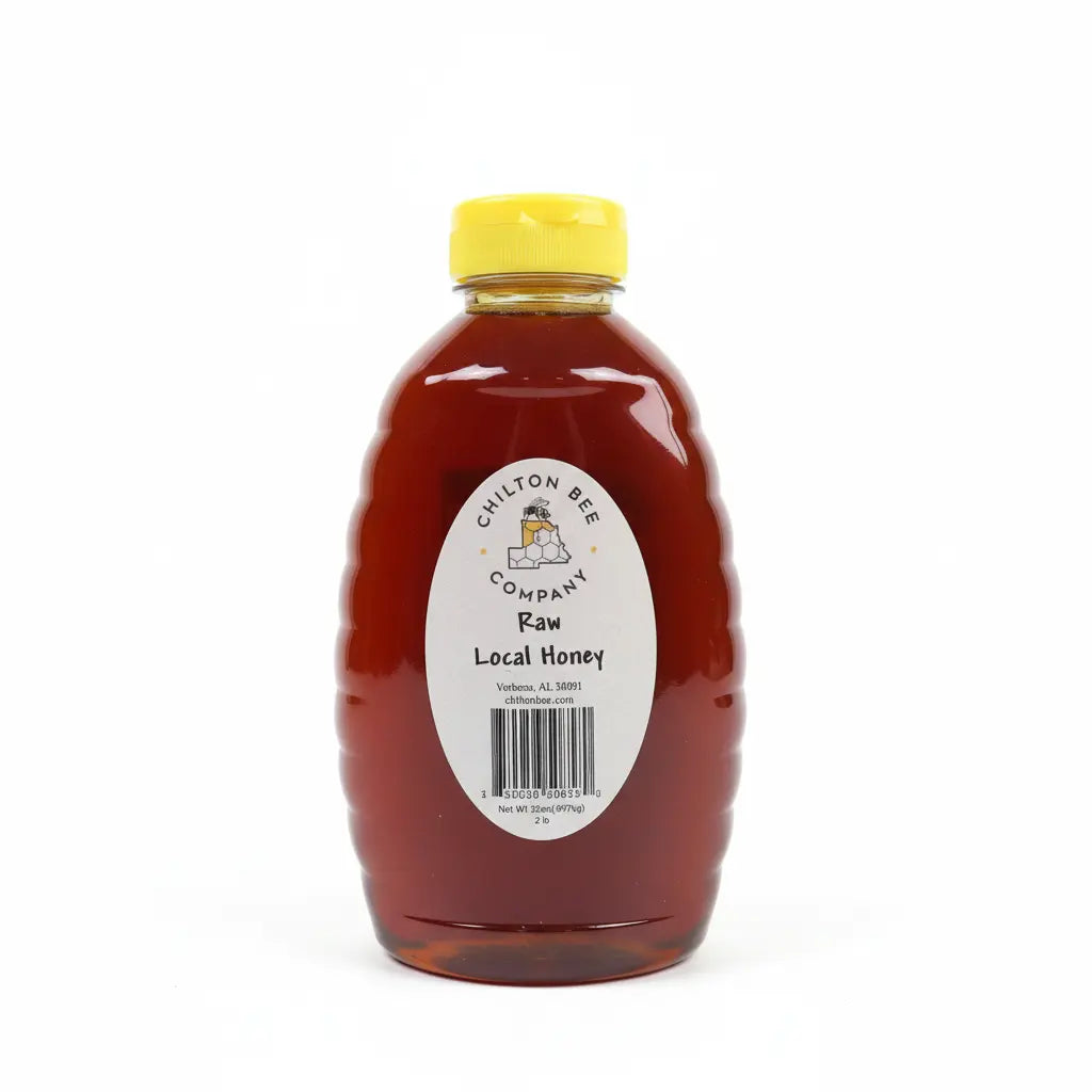 Bottle of Chilton Bee Company Raw Local Honey with a yellow lid.