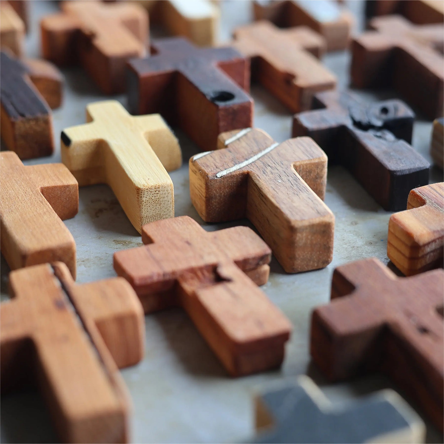 Collection of small, rustic wooden crosses