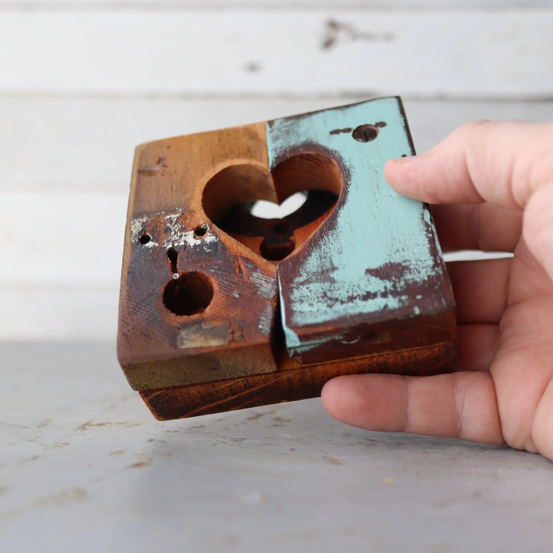 Two-toned rustic wooden heart with a center cut-out.