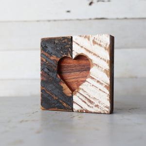 Two-tone rustic wooden heart cutout decor with distinct rough and smooth textures.