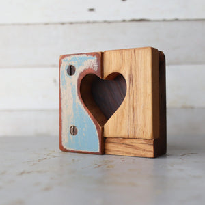 Rustic heart tiles made of two split wood pieces with a heart cut-out.