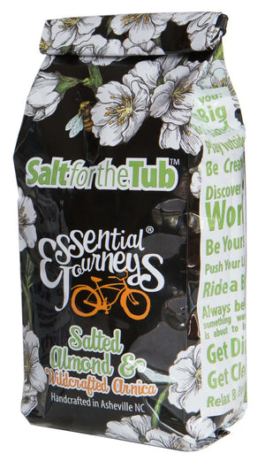 Salted Almond & Arnica bath salts bag with floral and bee design.