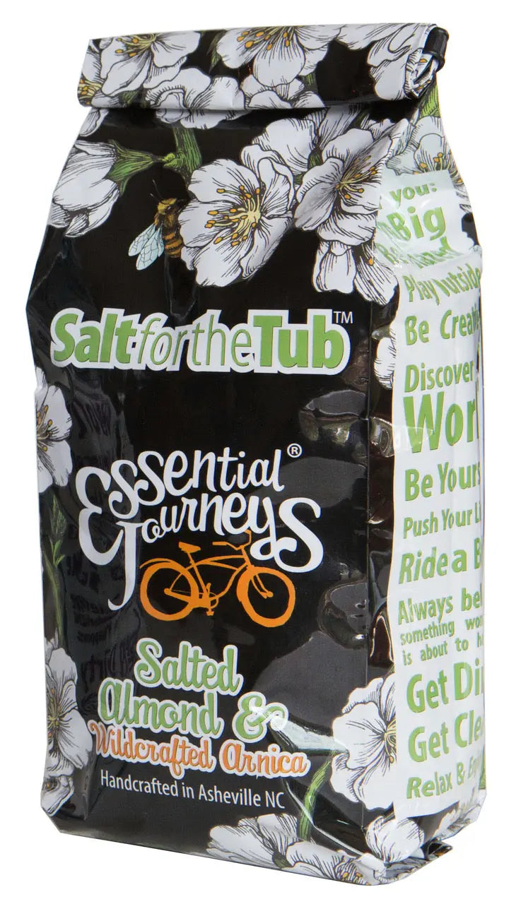 Salted Almond & Arnica bath salts bag with floral and bee design.