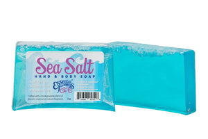 Blue sea salt bar soap with "Essential Journeys" label.
