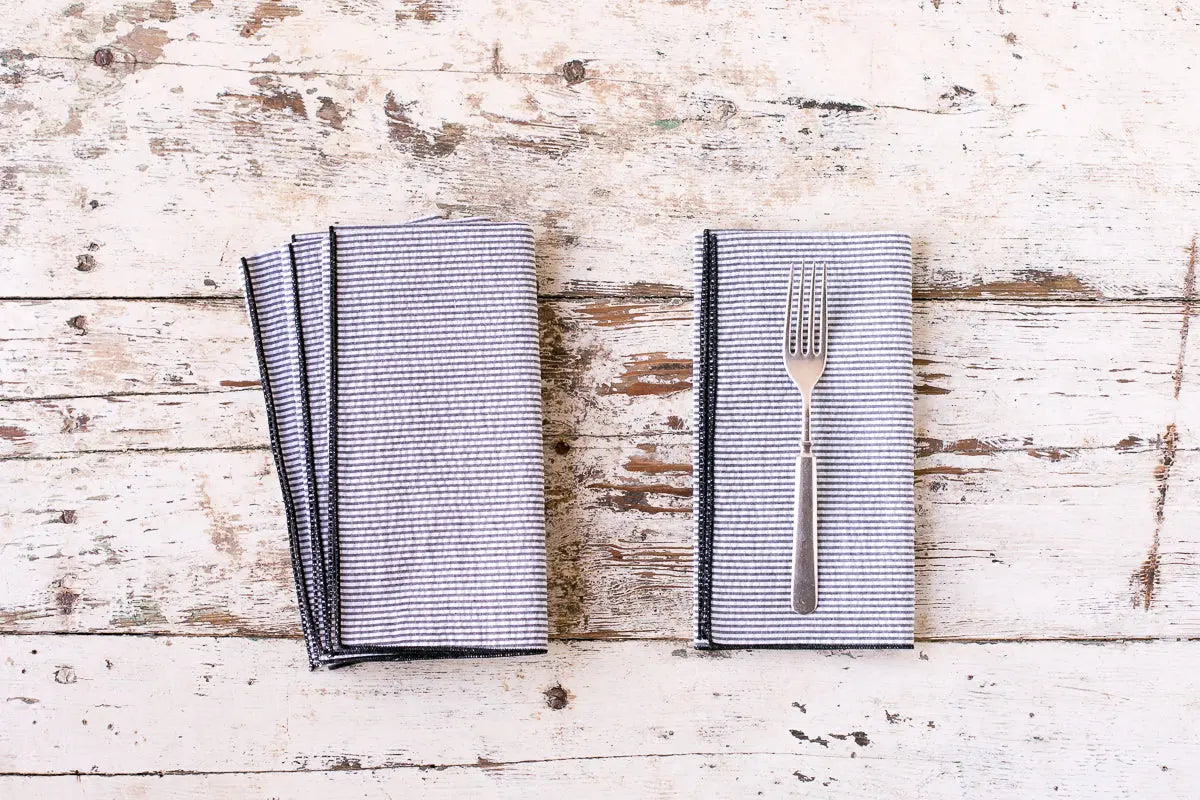 Seersucker Everyday Napkins set of four with striped pattern and fork on wood