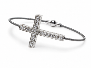 Silver cross bracelet with rhinestones on white background