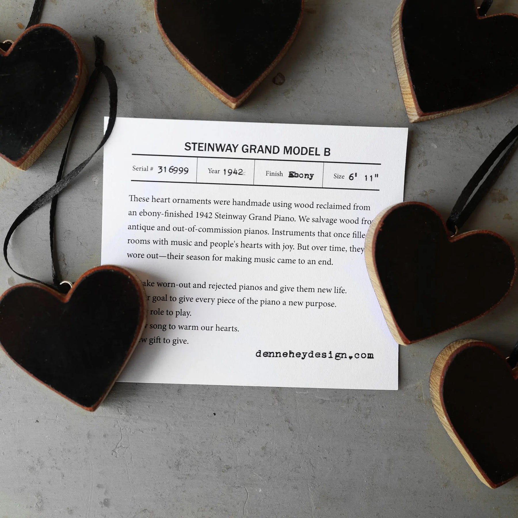 Black and wood heart ornaments made from a Steinway piano.