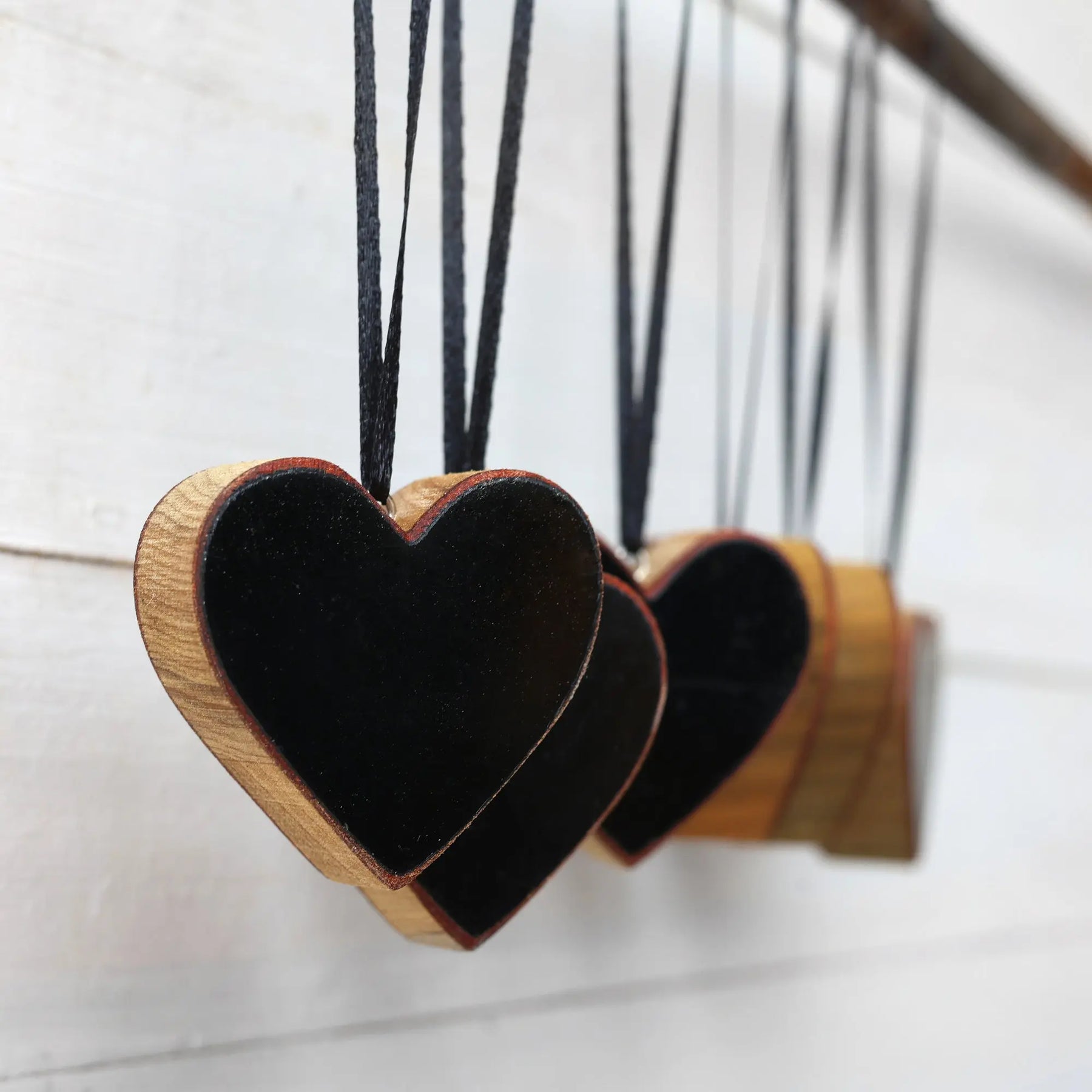 Handmade heart ornaments made from reclaimed Steinway piano wood.