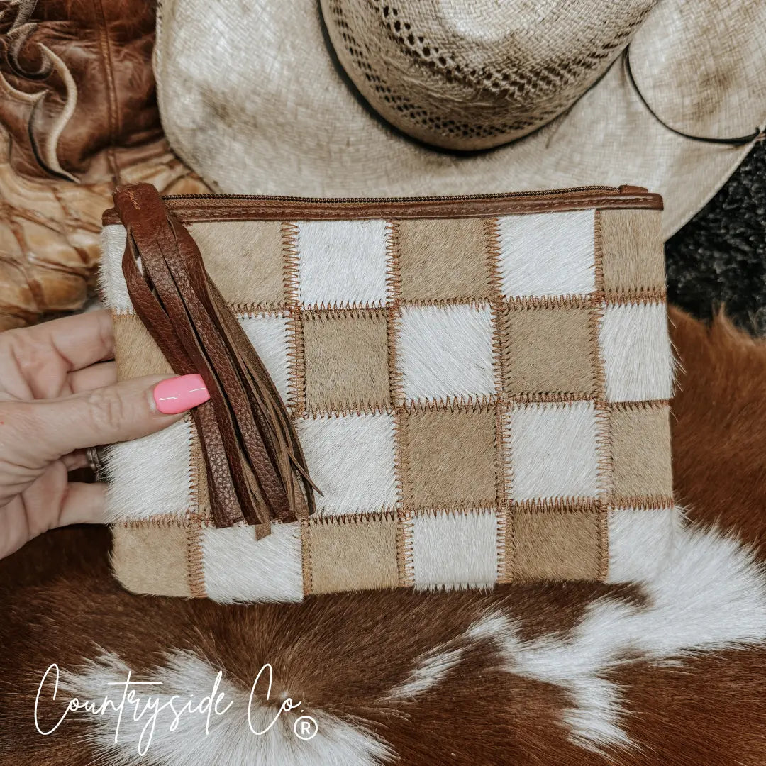 Checkerboard cowhide wristlet pouch with leather fringe tassel