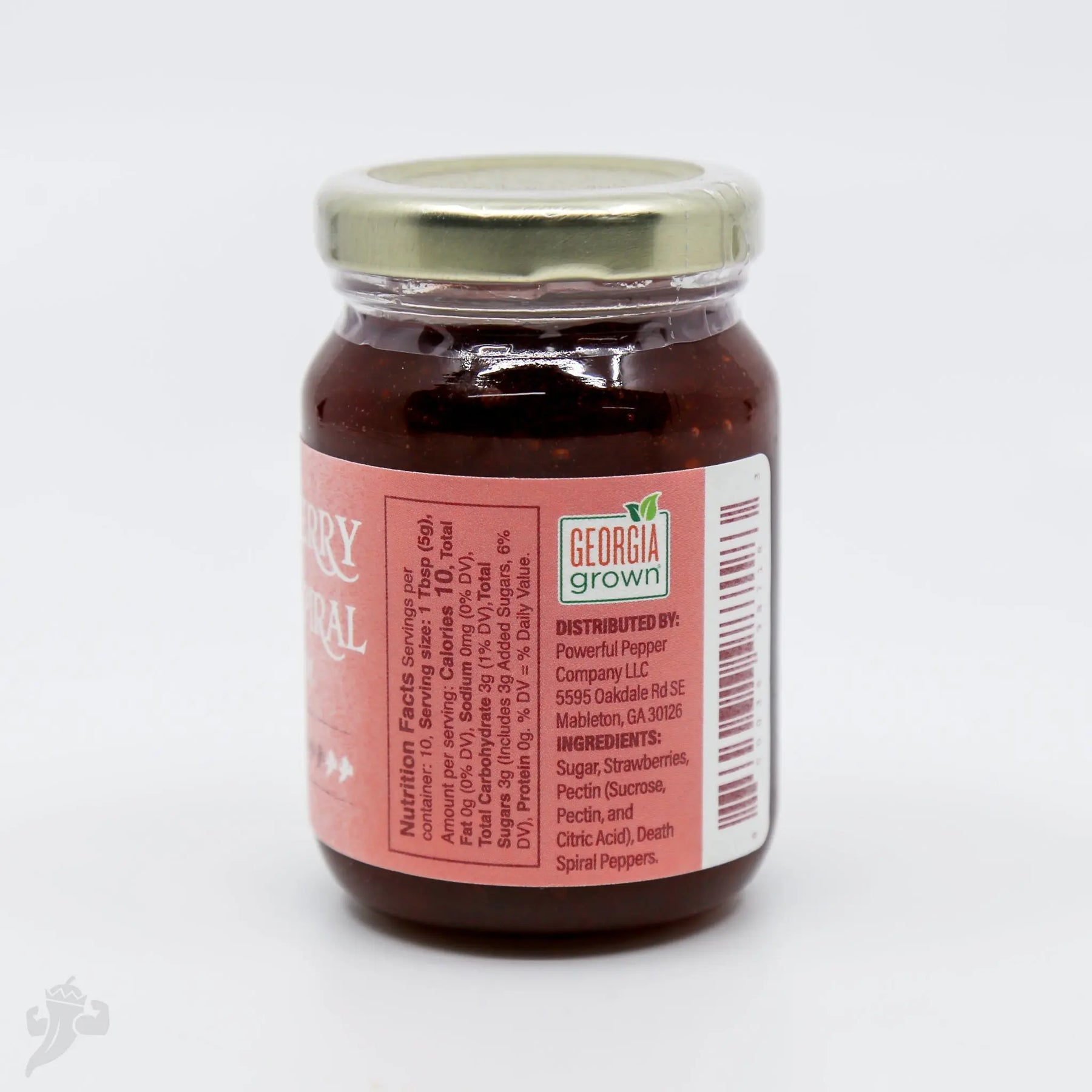 Strawberry Death Spiral Chili Jam in a glass jar with a gold lid.