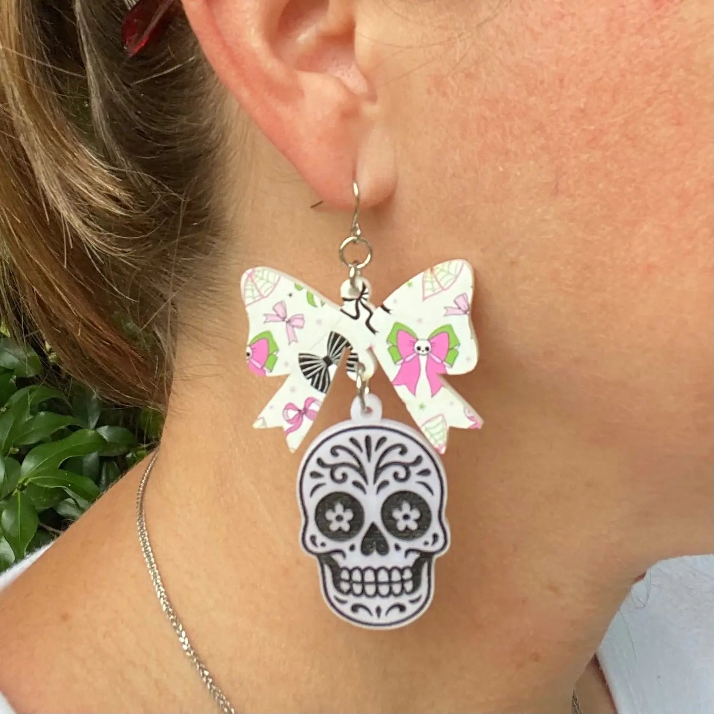 Bow & Sugar Skull Halloween Earrings - Acrylic Dangle Earring on Model - Main Street Collective