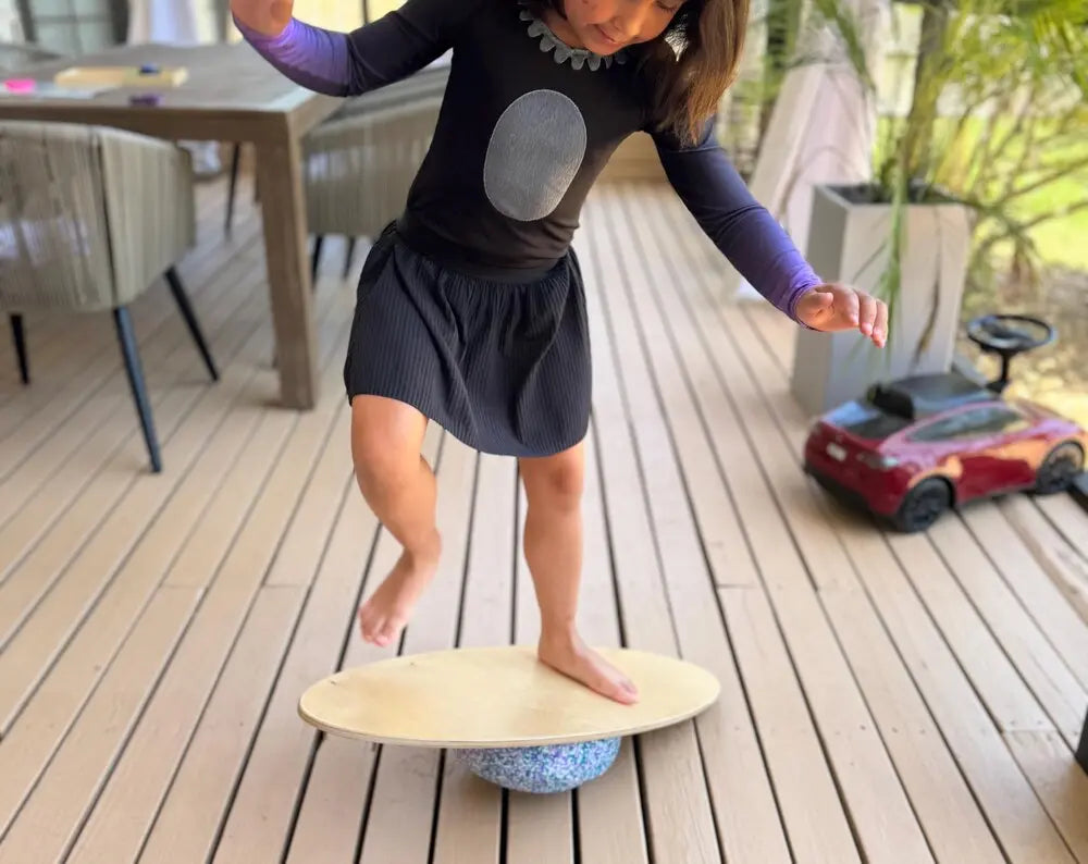 Wooden surf balance board for kids movement play with Stapelstein stepping stones