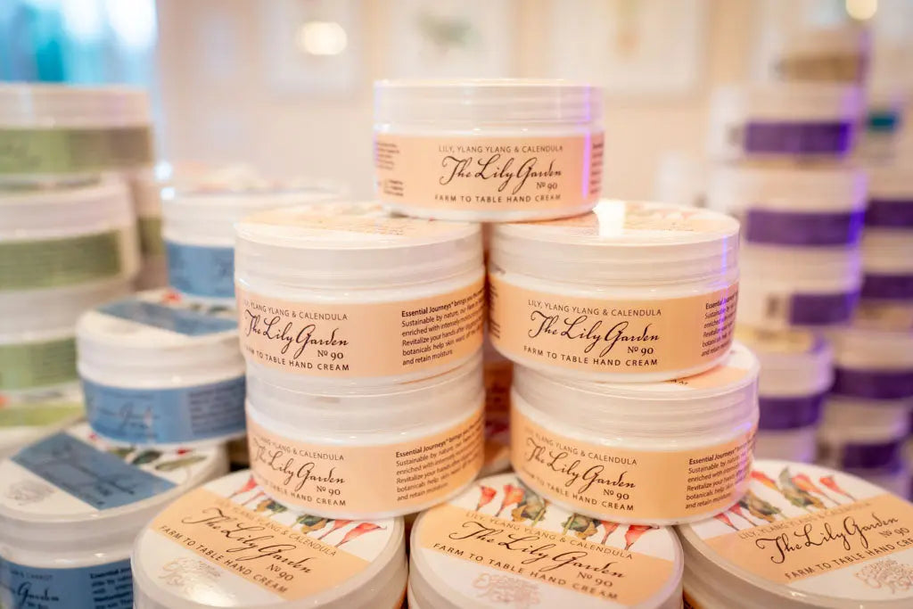 Jars of The Lily Garden Farm to Table Hand Cream with Lily, Ylang Ylang & Calendula.