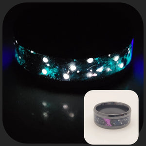 Glowing memorial ring with ashes and star pattern inlay, also shown in normal light with purple detail.