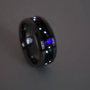 Memorial ring with ashes, black onyx, purple glow, and constellation design.