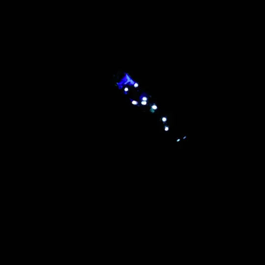 Constellation Memorial Ring close up showing blue and white glowing stars on black background.