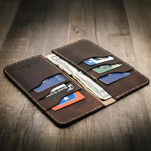Brown leather long wallet with multiple card slots and cash pockets