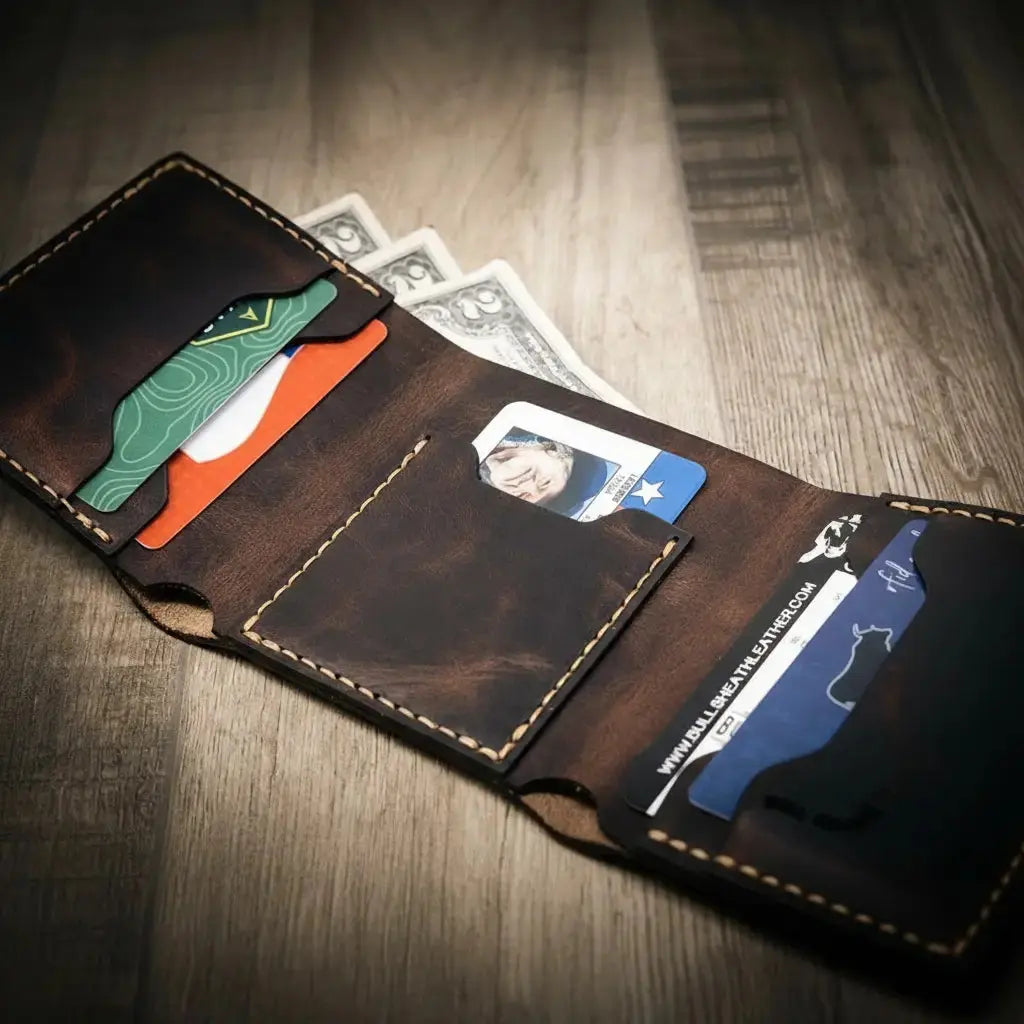 Dark brown leather trifold wallet with multiple card slots and cash.
