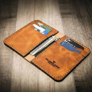 Brown leather vertical wallet with card slots and folded cash