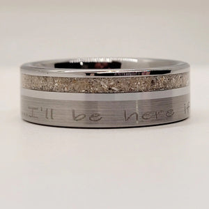 Tungsten ring with engraved text and sand inlay.