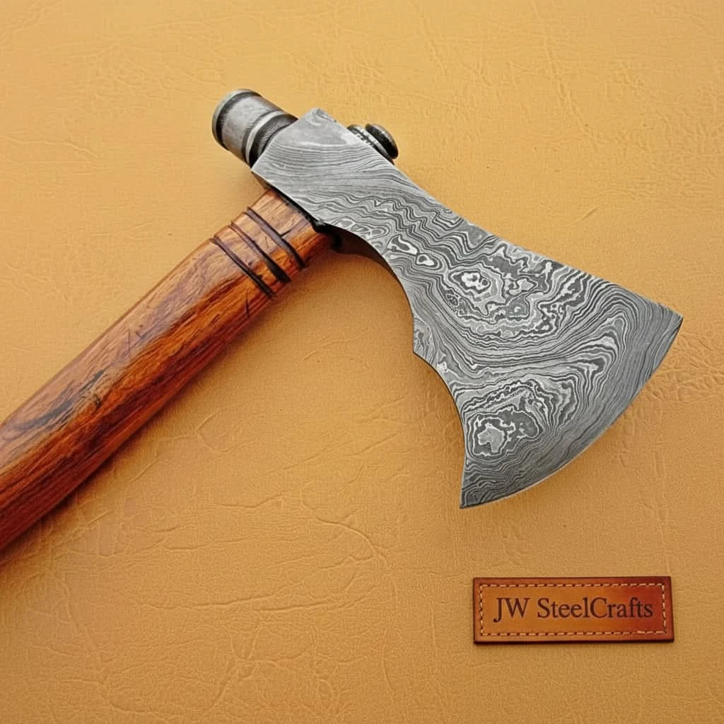 Damascus steel axe head with wood handle on rustic wood surface