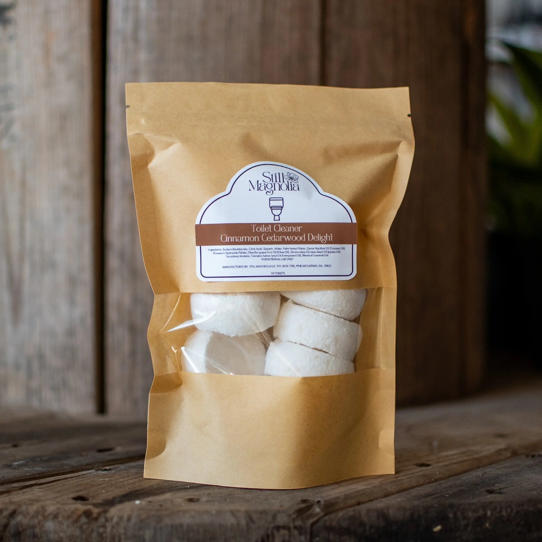 Still Magnolia Cinnamon Cedarwood Delight toilet cleaner tablets in brown paper packaging.